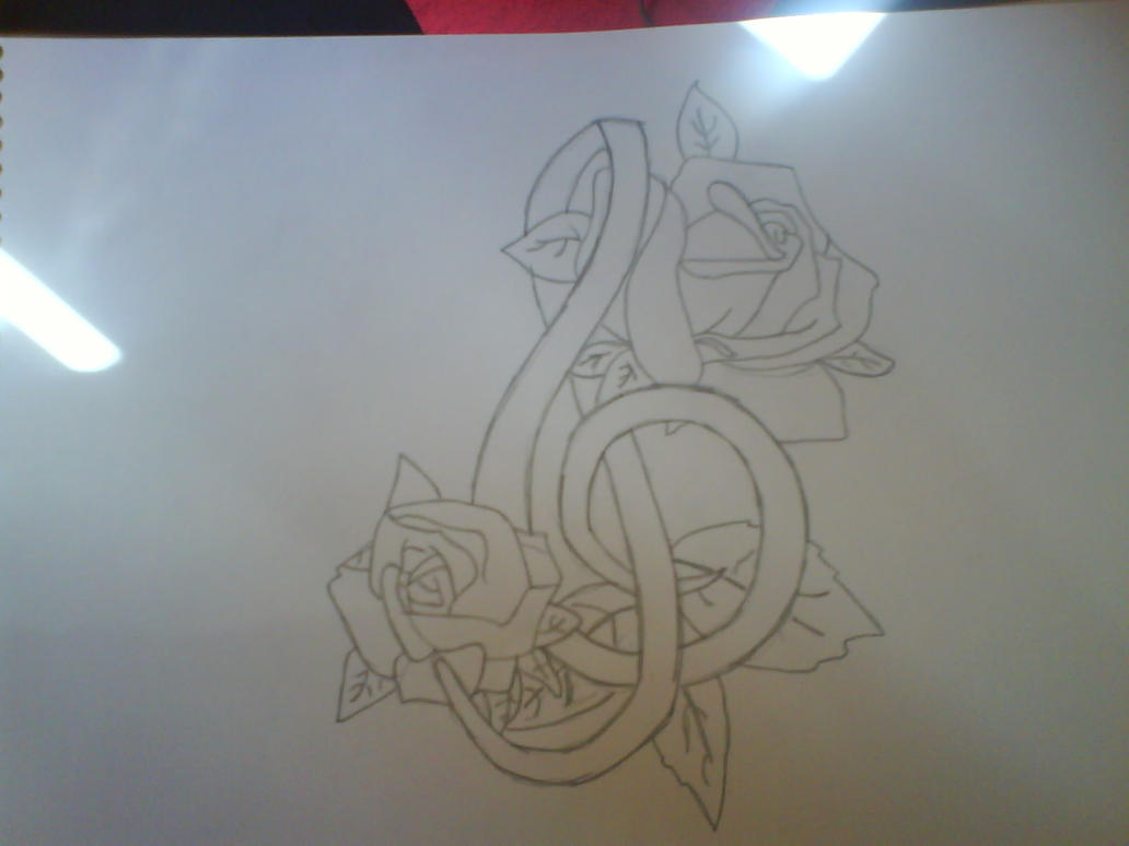 Music symbol and roses tattoo
